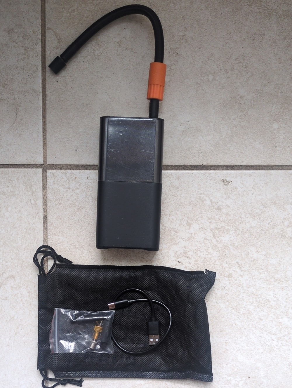 Portable Black Air Pump with Orange Valve Connector